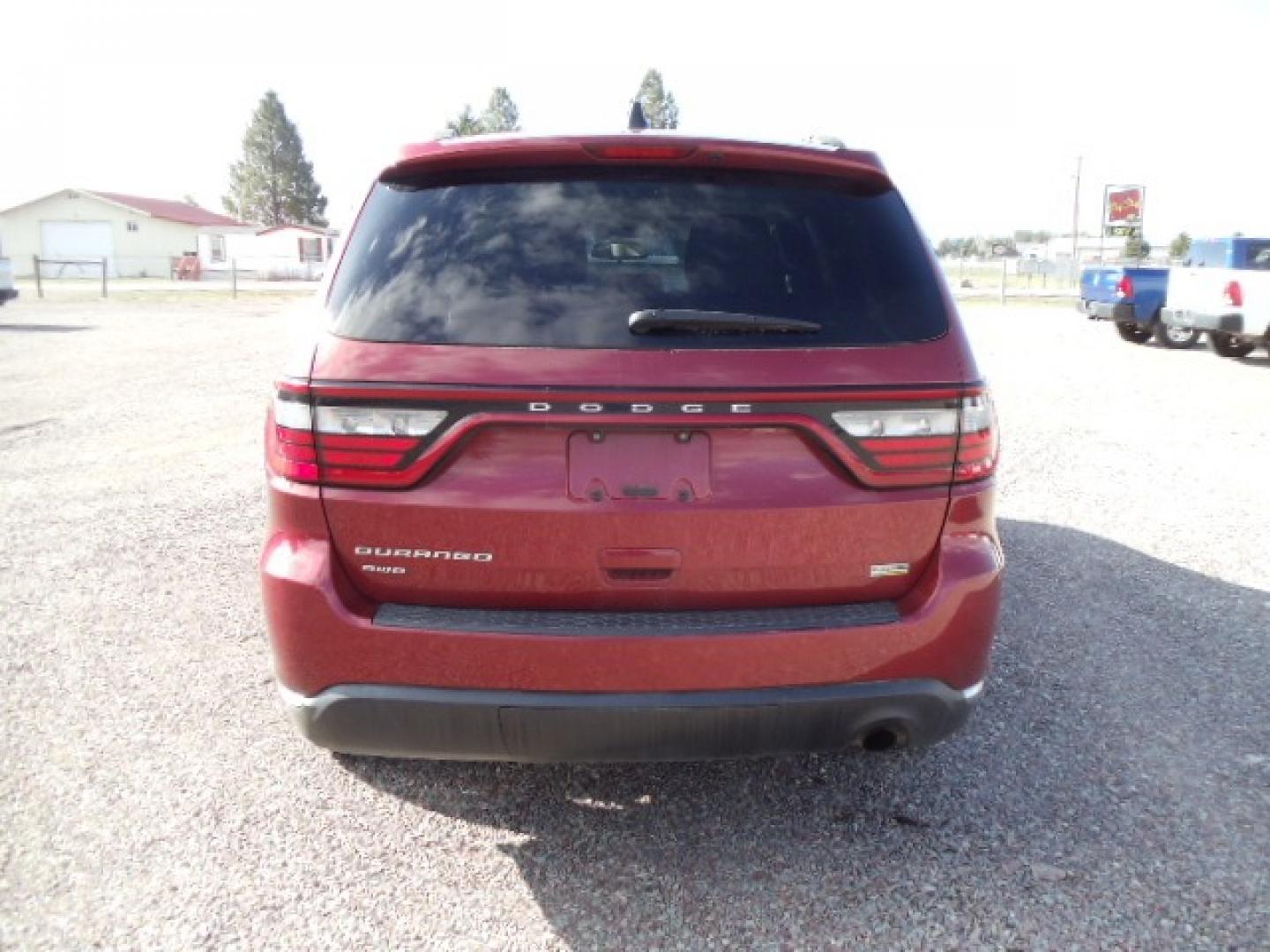 2014 red /Tan Dodge Durango SXT (1C4RDJAG5EC) with an 3.6 L VVT 6 Cylinder engine, Automatic transmission, located at 5465 Highway 2 W., Columbia Falls, MT, 59912, (406) 892-4407, 48.352188, -114.240929 - This SUV was previously owned by the federal government so it has been well maintained and taken care of. This Durango is super clean inside and out with near new tires and low actual miles. This vehicle is a 7 passenger. - Photo#5